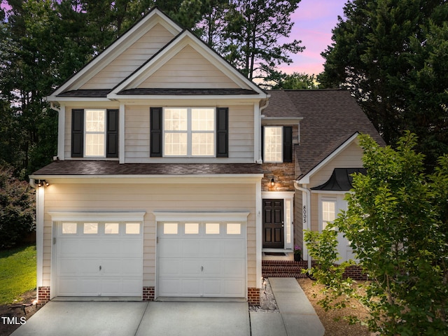 8005 Chatahoochie Ln, Raleigh, NC 27616 - view of front of property featuring driveway, an attached garage, and a shingled roof