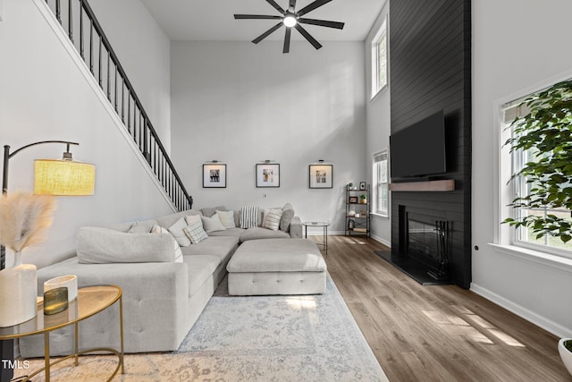 8005 Chatahoochie Ln, Raleigh, NC 27616 - living area featuring ceiling fan, plenty of natural light, a large fireplace, and a high ceiling