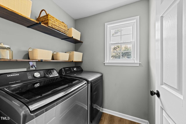8005 Chatahoochie Ln, Raleigh, NC 27616 - laundry area featuring washer and clothes dryer and wood finished floors