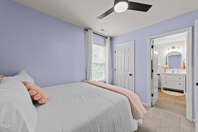 8005 Chatahoochie Ln, Raleigh, NC 27616 - carpeted bedroom featuring connected bathroom and ceiling fan