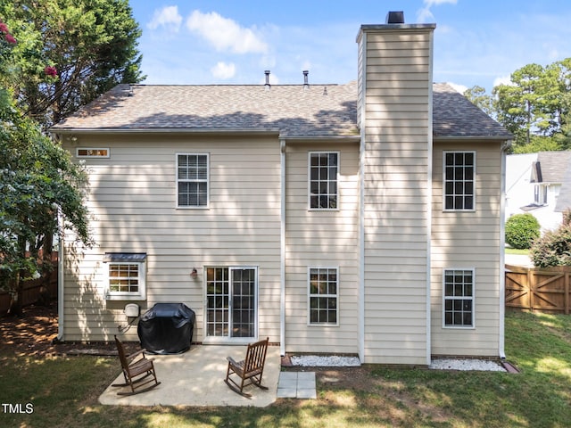 8005 Chatahoochie Ln, Raleigh, NC 27616 - back of property featuring a chimney, a patio, and roof with shingles