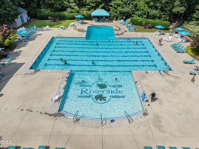 8005 Chatahoochie Ln, Raleigh, NC 27616 - community pool with a gazebo, a patio area, and view of wooded area