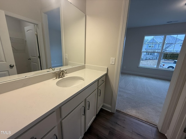 bathroom featuring vanity and hardwood / wood-style floors