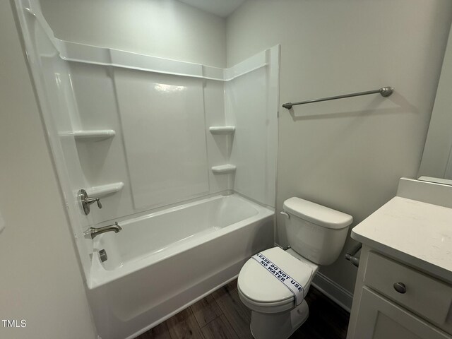 full bathroom with vanity, toilet, shower / bath combination, and wood-type flooring