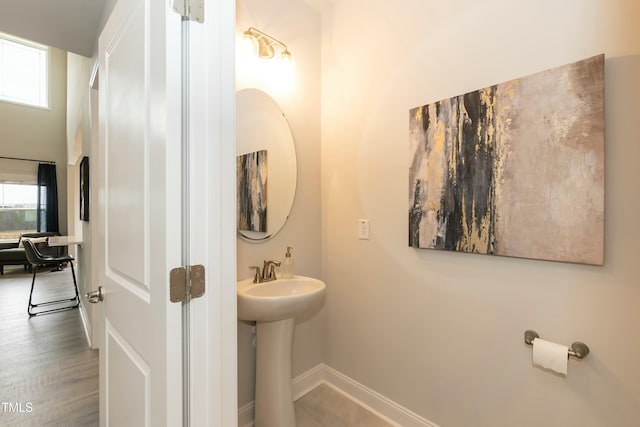 bathroom with hardwood / wood-style flooring