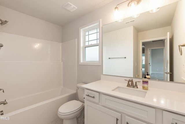 full bathroom with shower / bath combination, vanity, and toilet