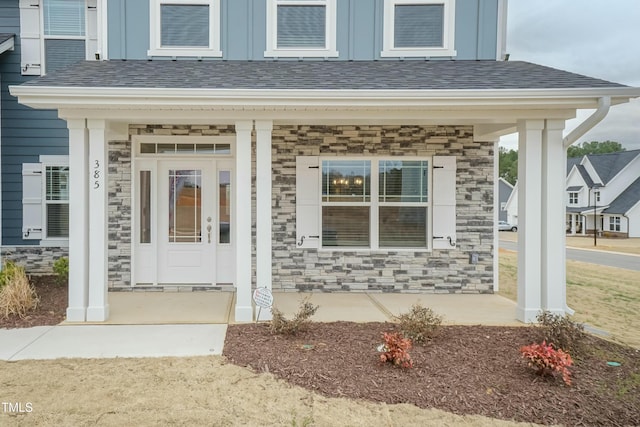 entrance to property featuring covered porch