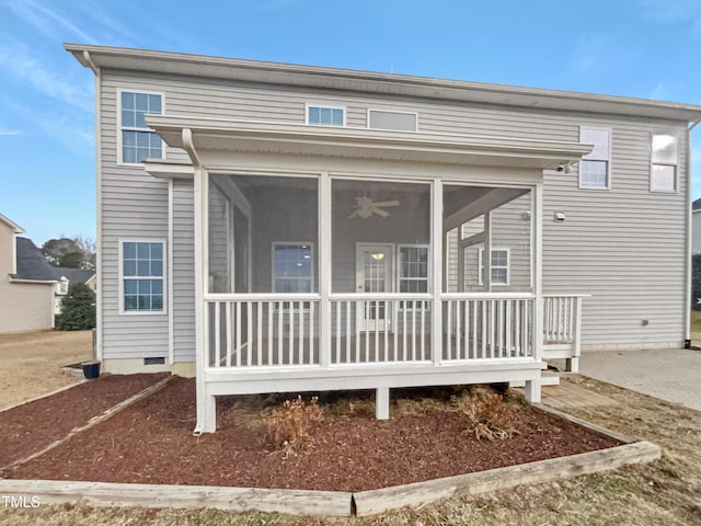 rear view of house with a sunroom