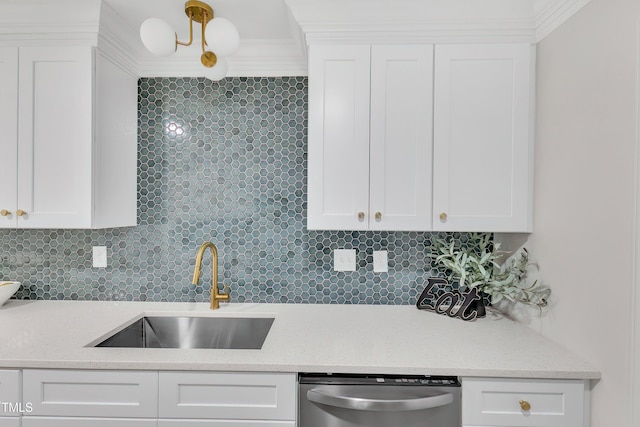 kitchen with white cabinetry, sink, decorative backsplash, and stainless steel dishwasher