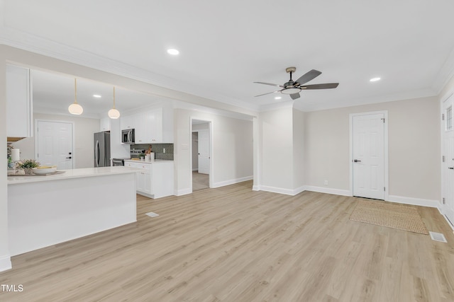 unfurnished living room featuring ornamental molding, ceiling fan, and light hardwood / wood-style floors