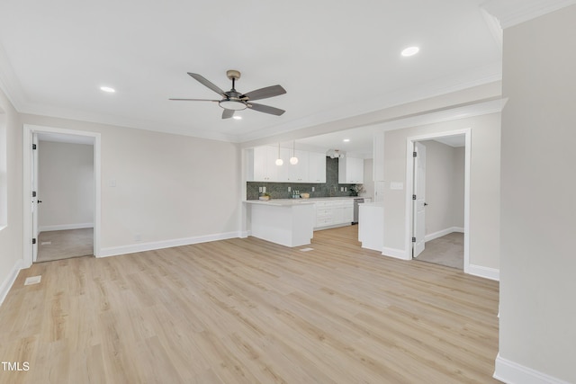 unfurnished living room with crown molding, ceiling fan, and light hardwood / wood-style flooring