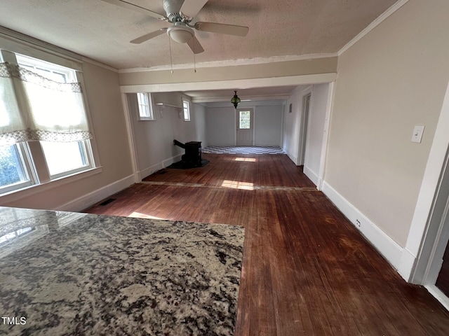 hall featuring crown molding, dark hardwood / wood-style floors, and a textured ceiling