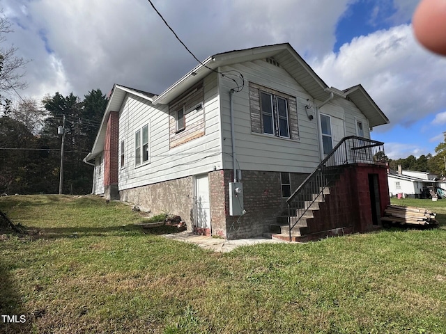 view of property exterior with a yard