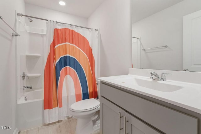 bathroom with toilet, recessed lighting, vanity, and shower / bath combo with shower curtain