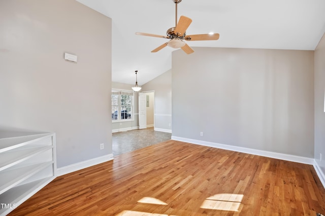 unfurnished living room featuring lofted ceiling, wood-type flooring, and ceiling fan