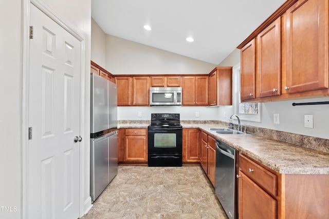 kitchen featuring lofted ceiling, sink, and stainless steel appliances