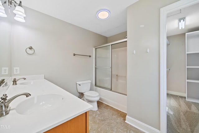 full bathroom with vanity, toilet, and combined bath / shower with glass door