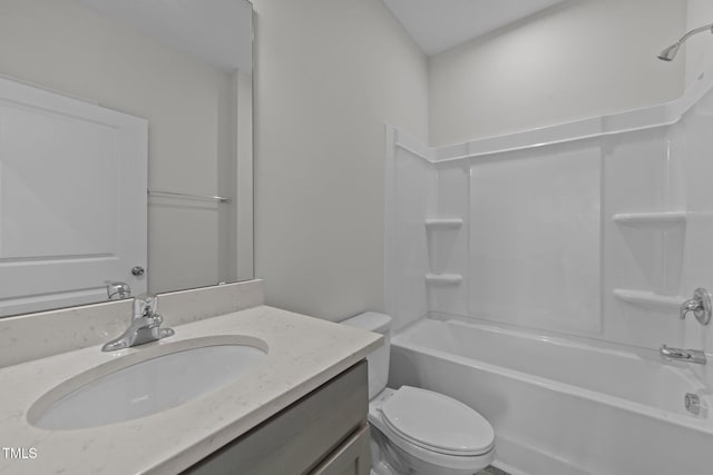 full bathroom featuring vanity, bathing tub / shower combination, and toilet