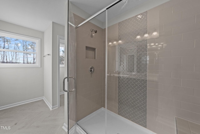 bathroom with a shower with shower door