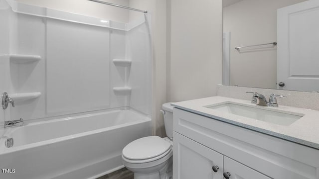 full bathroom featuring vanity, bathing tub / shower combination, and toilet