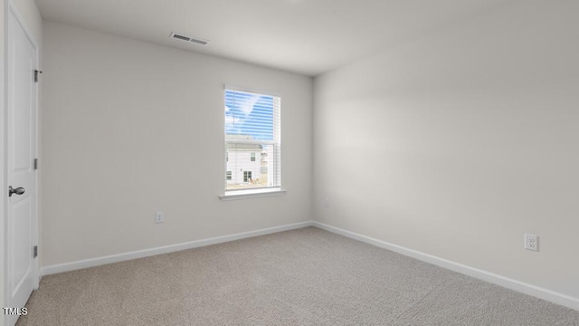 spare room with carpet floors