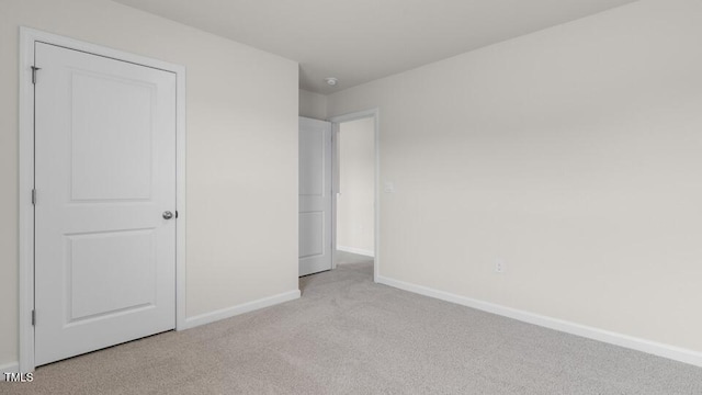 unfurnished bedroom with light carpet