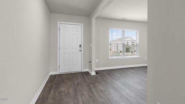 foyer entrance with dark hardwood / wood-style floors