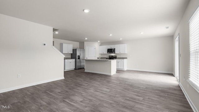 unfurnished living room featuring wood-type flooring