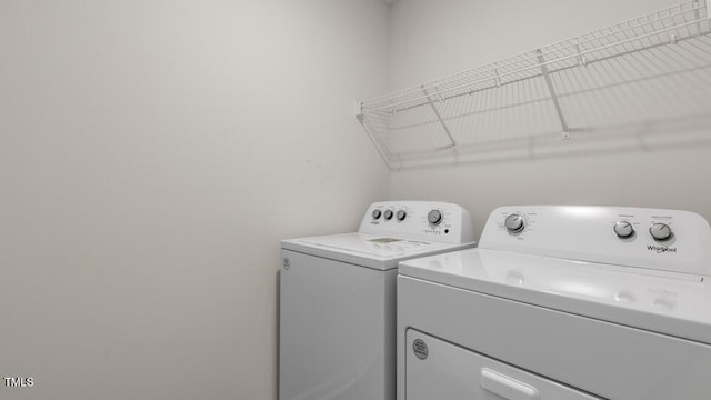 laundry room featuring separate washer and dryer