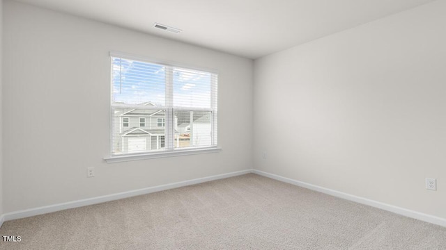 unfurnished room with carpet flooring