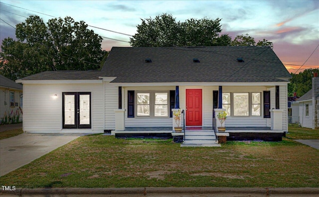 view of front facade featuring a lawn and a porch