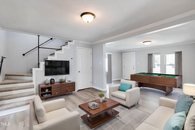 living room featuring crown molding, light hardwood / wood-style flooring, and billiards