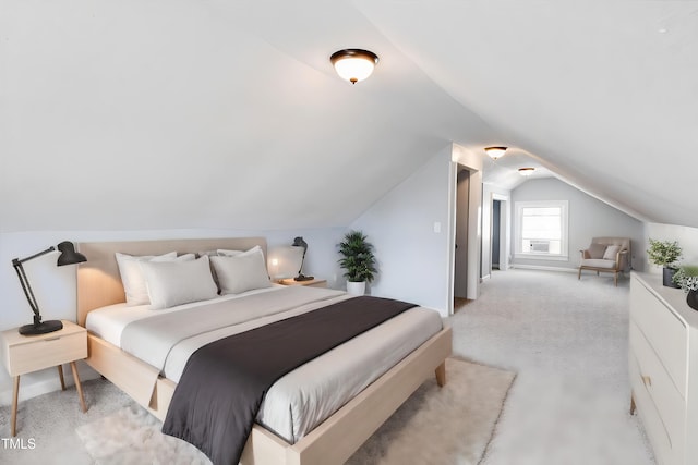 carpeted bedroom with lofted ceiling