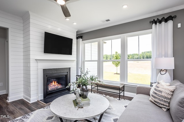 living room featuring ornamental molding, dark hardwood / wood-style floors, and ceiling fan