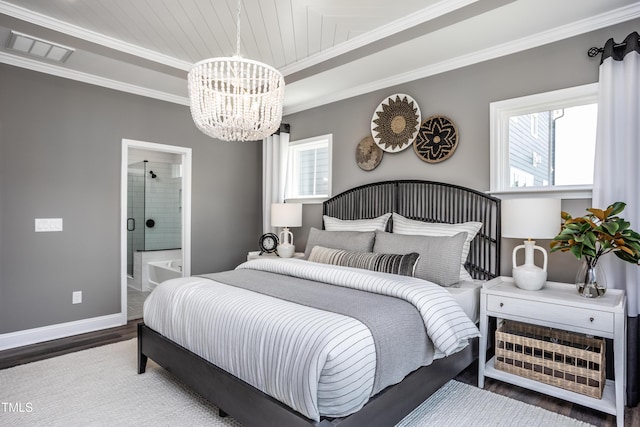 bedroom featuring an inviting chandelier, crown molding, wood-type flooring, and ensuite bathroom