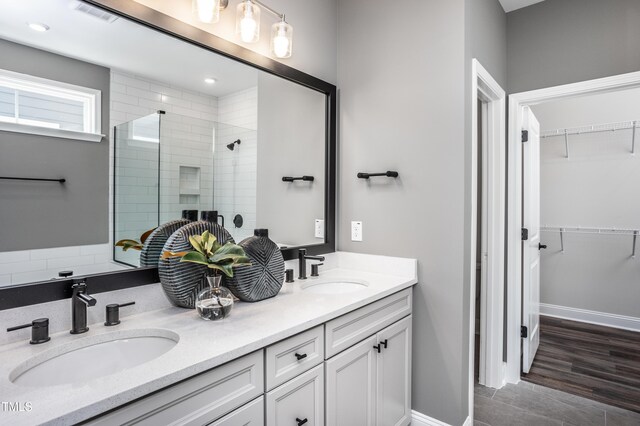 bathroom with vanity and an enclosed shower