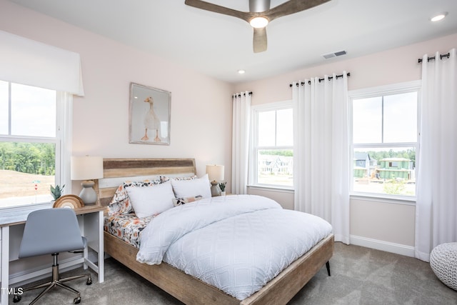 bedroom with ceiling fan and carpet