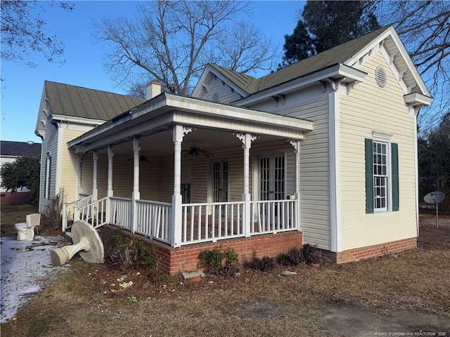 exterior space featuring ceiling fan and covered porch