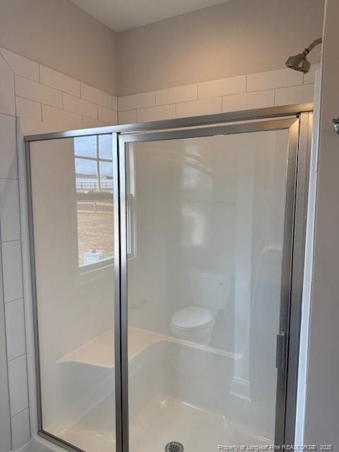 bathroom with a stall shower