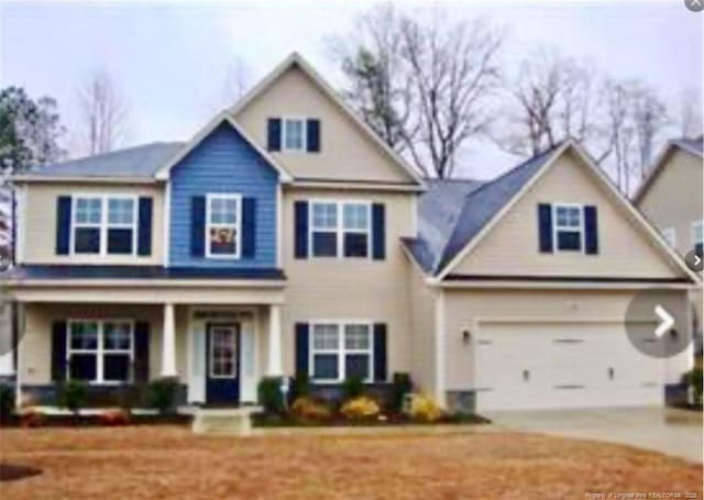 view of front facade featuring a garage and a porch