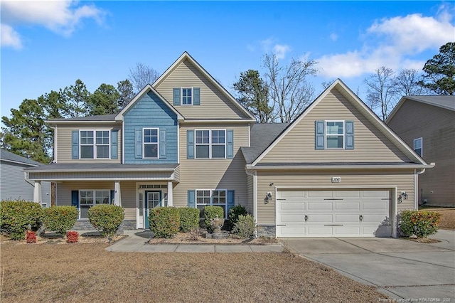 view of front of home with a garage and a porch