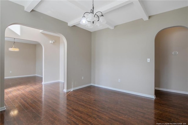 spare room with beamed ceiling, a notable chandelier, and dark hardwood / wood-style flooring