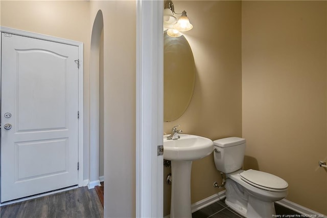 bathroom featuring sink and toilet