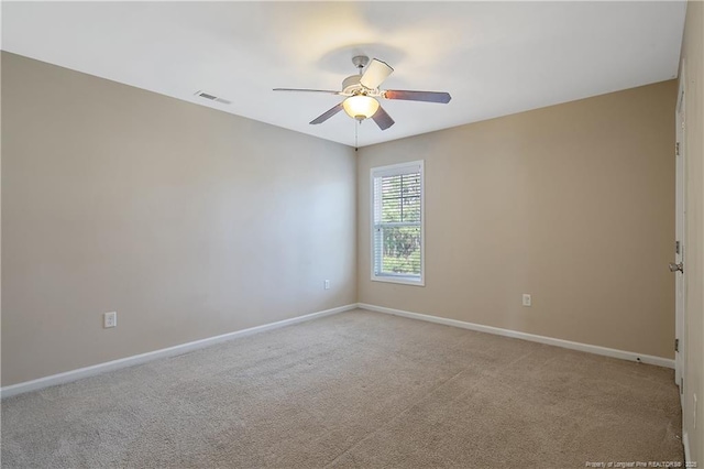 spare room with light carpet and ceiling fan