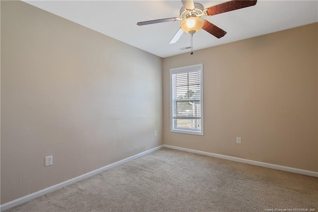 unfurnished room with ceiling fan and light colored carpet