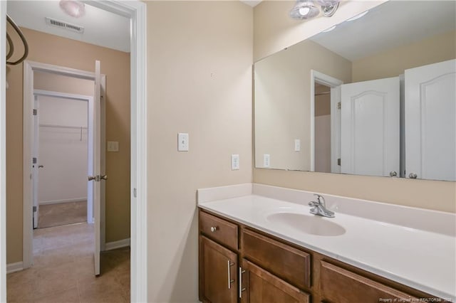 bathroom featuring tile patterned floors and vanity