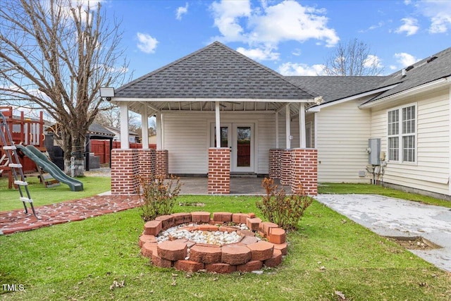 exterior space with a playground, a gazebo, a patio area, and an outdoor fire pit