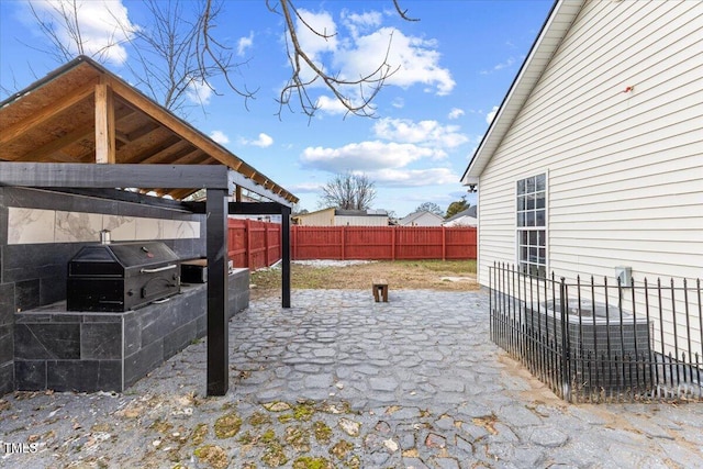 view of patio featuring a grill