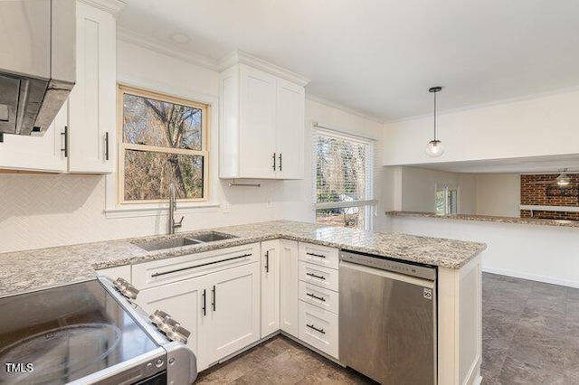 kitchen with appliances with stainless steel finishes, white cabinetry, sink, hanging light fixtures, and light stone countertops