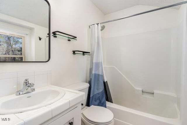 full bathroom with tasteful backsplash, shower / tub combo with curtain, vanity, and toilet